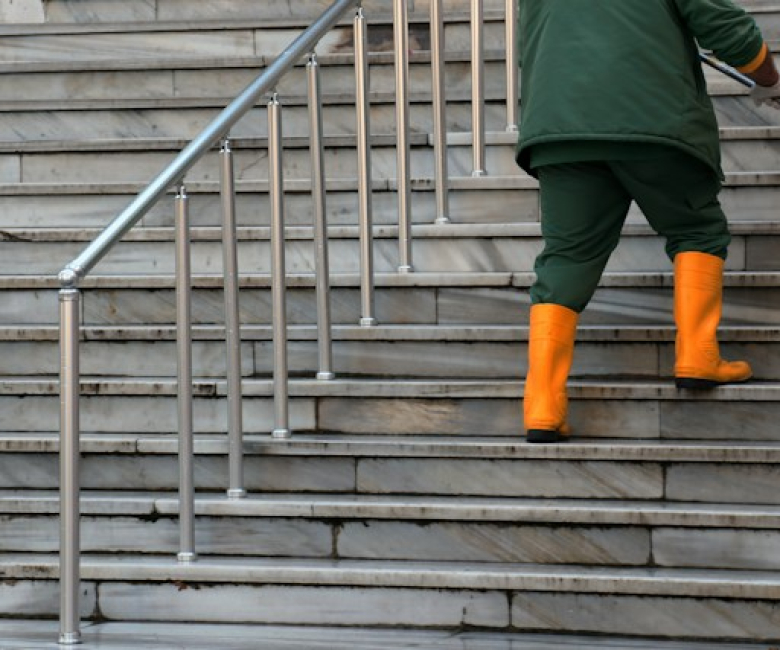 image of a cleaner washing a staircase